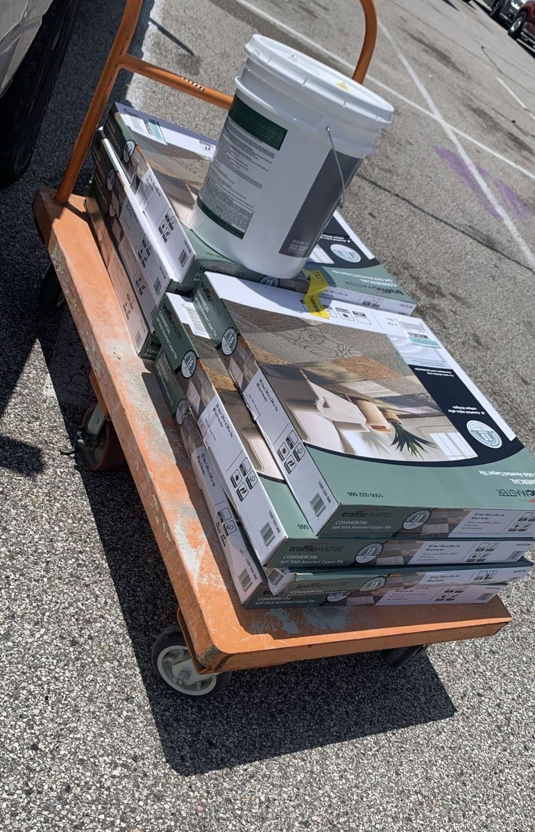 Cart of broken-out tile and demo material